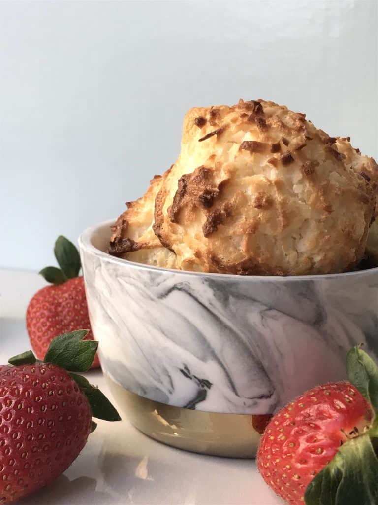 Coconut Macaroons in a bowl with strawberries. picture from Kid-Approved Chocolate Dipped Coconut Macaroons Coconut Cookies