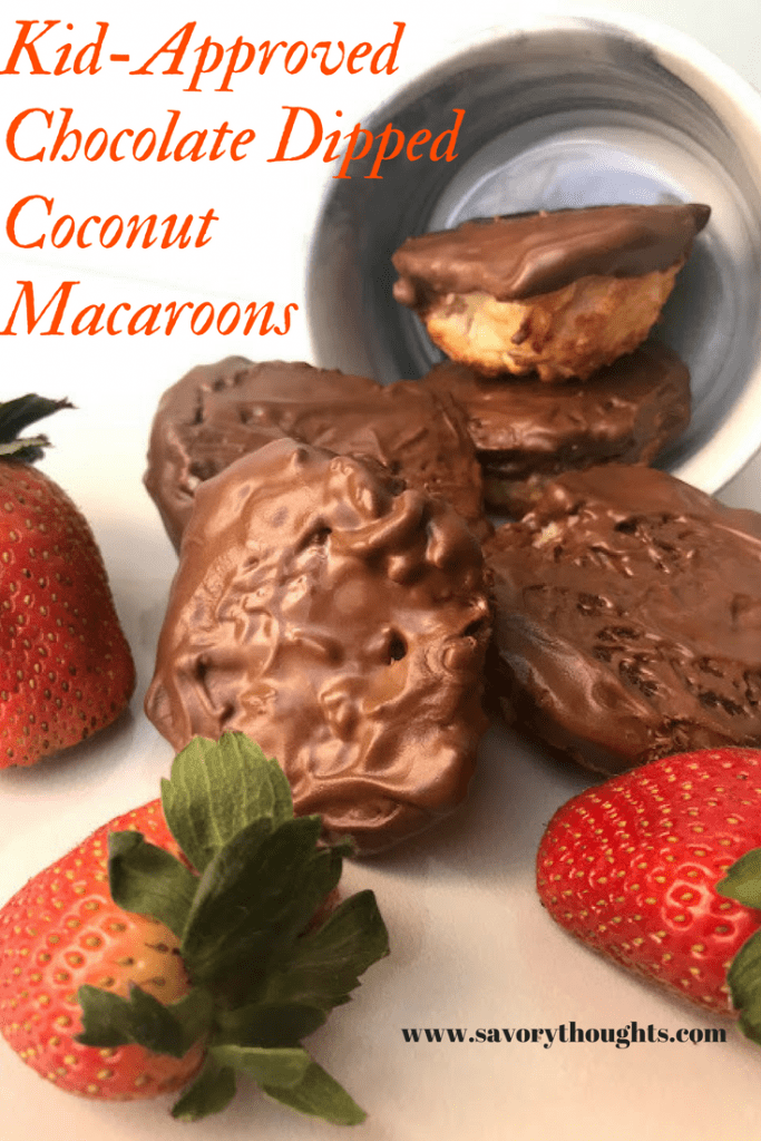 Ridiculously addictive but yet decadent, kid friendly and approved Coconut Macaroons. These cookies will you coming back for more and is perfect for any occasion! Savory Thoughts. #coconutmacaroons #coconut #macaroons #chocolate #recipes Coconut Macaroons covered in dark chocolate with strawberries