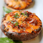 Portobello Mushroom Pizza With Prosciutto! Easy and delicious mushroom pizza that's keto proof, 30-minute proof, low carb, and made quickly with a few ingredients. #portobellomushroompizza #mushroompizza #prosciuttopizza #prosciutto #weeknightmeals #weeknightdinner #pizza #portobellopizza
