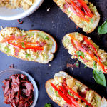 Easy Breakfast Bruschetta - Toasted bread topped with guacamole, eggs, and turkey bacon. This breakfast bruschetta recipe is not only easy to make but is also a great way to mix up an ordinary breakfast. #breakfast #bruschetta #breakfastbruschetta #brunch #healthy #avocado #recipe #appetizers #breads #lunches #snacks #mornings