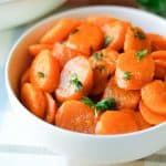 Glazed carrots are an easy simple elegant side dish to prepare for any occasion. These carrots are simmered in a mixture of orange juice, brown sugar, salt, and butter. #glazedcarrots #carrots #brownsugarglazedcarrots