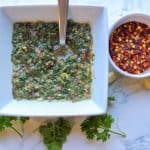Scrumptious chimichurri cilantro made with fresh parsley. Chimichurri dressing blended with garlic, olive oil, and apple cider vinegar. Delicious on beef, fish, and chicken. It is gluten-free, paleo, and vegan! If you have never made this chimichurri sauce, you are in for an EPIC change with your taste buds. This herbal sauce is filled with bold flavors.