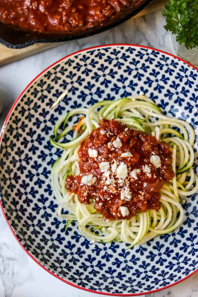 Beef Bolognese Recipe - Savory Thoughts. Sauce and noodles wrapped around fork.