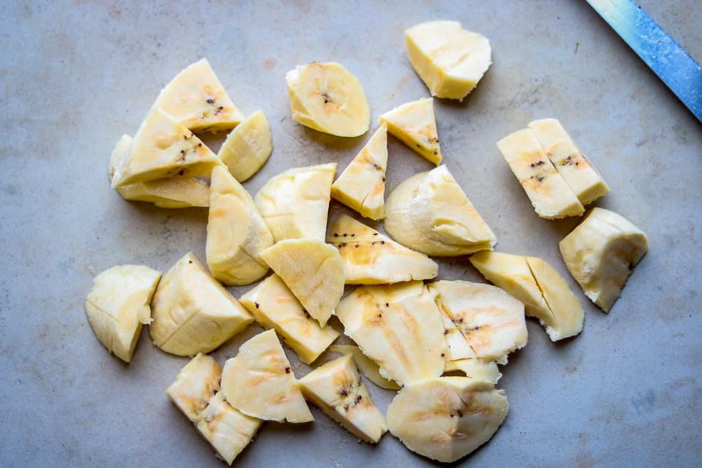 Plantain Bread - Plantain Cake - Savory Thoughts Plantain Bread - Plantain Cake - Cut up plantains for plantain bread recipe