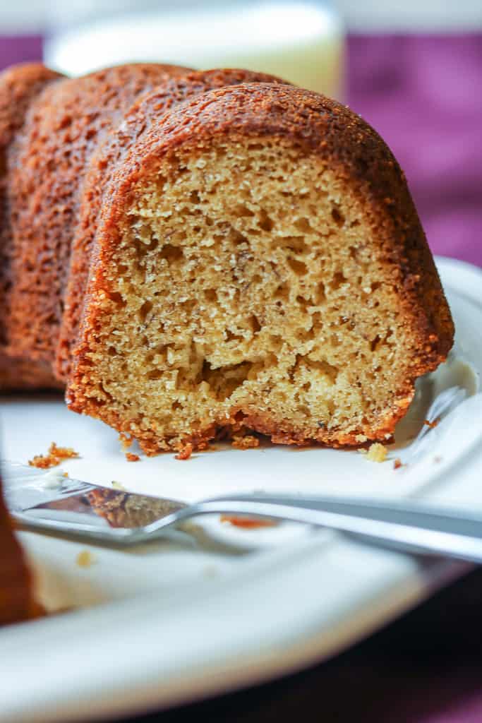 Plantain Bread - Plantain Cake - Savory Thoughts Plantain Bread - Savory Thoughts - Bread fixed on a purple tablecloth with a glass of milk and plantain bread in dessert plates with butter knife. If you are not familiar with plantain bread (plantain cake), you are in for a treat. This bread is gluten-free, delicious, and is a perfect alternative to banana bread and a great way to use your ripe plantains.