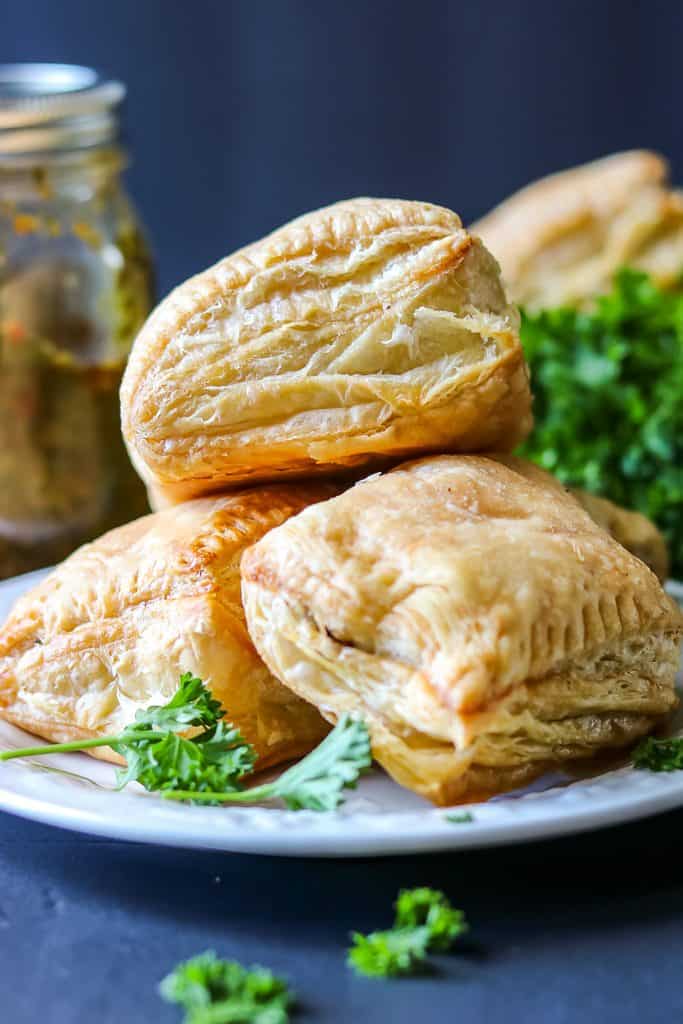 Haitian Patties (Haitian Pate) Recipe - BHM Virtual Potluck stacked patties on white plate.