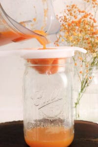 Pouring juice in strainer