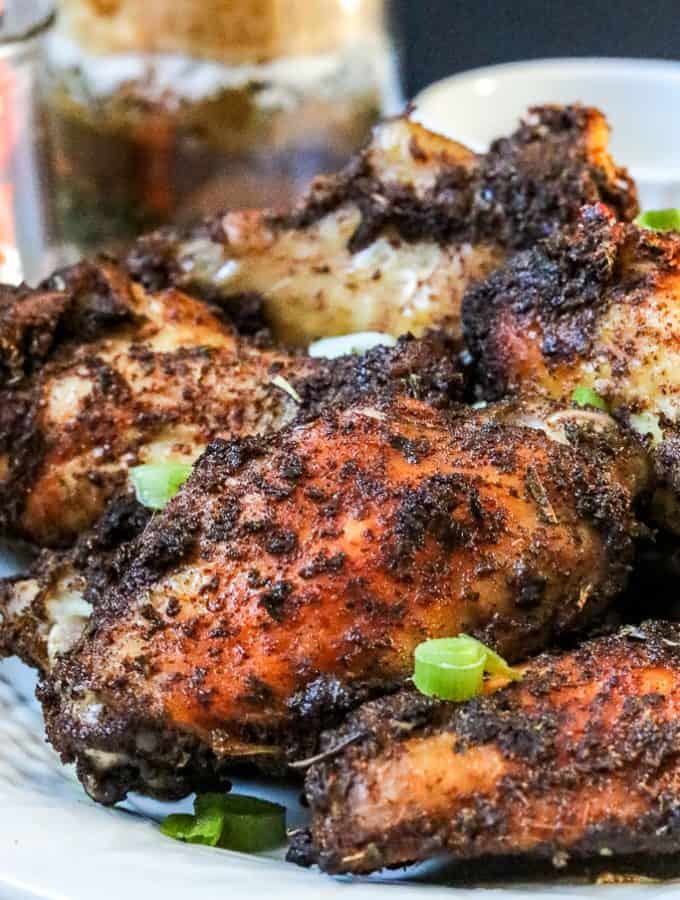 Jamaican Jerk Chicken Wings – flavorful, ridiculously delicious, and easy to make right in your kitchen. No need to travel to the local Caribbean store to get these wings. These wings are full of spice and extremely addictive. #Jamaicanjerkwings #spicywings #jerkwings #jamaicanrecipe #homemadeseasoning #jerkseasoning