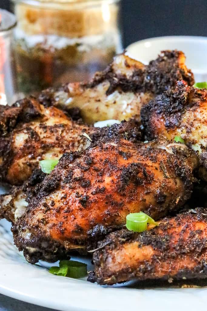 Jamaican Jerk Chicken Wings – flavorful, ridiculously delicious, and easy to make right in your kitchen. No need to travel to the local Caribbean store to get these wings. These wings are full of spice and extremely addictive. #Jamaicanjerkwings #spicywings #jerkwings #jamaicanrecipe #homemadeseasoning #jerkseasoning