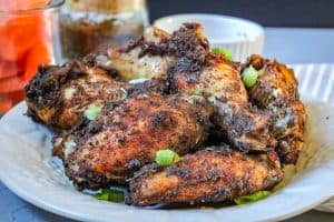Jamaican Jerk Chicken Wings – flavorful, ridiculously delicious, and easy to make right in your kitchen. No need to travel to the local Caribbean store to get these wings. These wings are full of spice and extremely addictive. #Jamaicanjerkwings #spicywings #jerkwings #jamaicanrecipe #homemadeseasoning #jerkseasoning