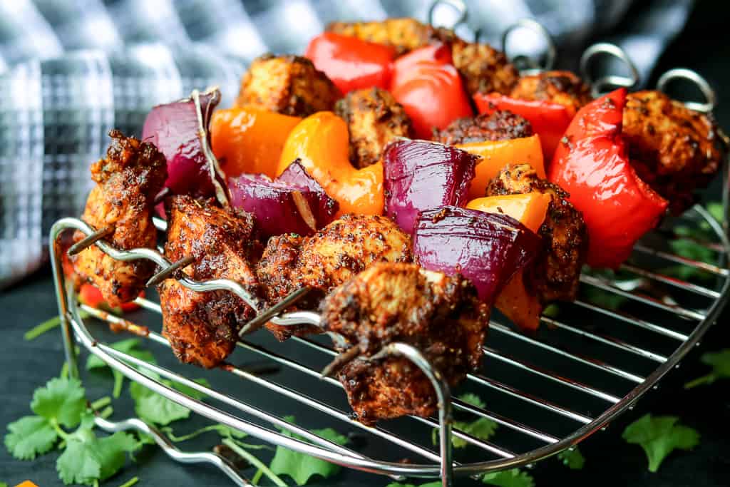 Air Fryer Grilled Chicken Fajita threaded with red onions and bell peppers.