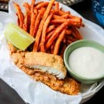 Crispy, juicy, tender air fryer tilapia cooked to perfection to create the best air fryer fish and chips recipe. These Air Fryer Fish and Chips are exactly what you need to put on the menu every week! Air Fryer recipes are an excellent way to enjoy healthy, crispy foods. The air fryer tilapia is cooked to perfection without using a large amount of oil. #airfryerfishandchips #glutenfreefish #bestfishandchips #Airfryerfishandchipsrecipes
