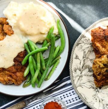 Chicken fried steak with mashed potatoes and green beans