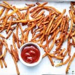 Air Fryer Shoestring fries seasoned and fried on a platter with ketchup.