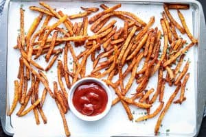 Air Fryer Shoestring fries seasoned and fried on a platter with ketchup.