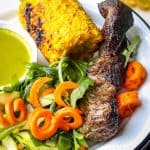 Easy Grilled Marinated Country Style Ribs plated with spiral carrots, arugula and zucchini, with grilled corn #MarinadesWithMazola #MakeItWithHeart #CollectiveBias