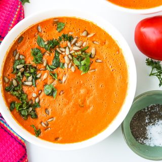 Homemade Tomato Soup recipe topped with fresh herbs