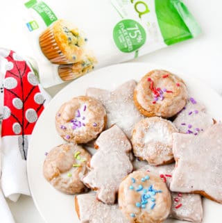 Holiday Molasses cookies on white plate with trivia package