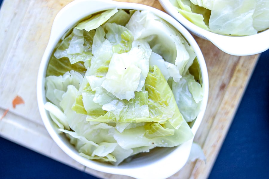 Steam cabbage in white bowl. 