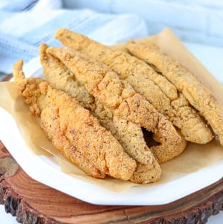 Fried whiting fish recipe on white plate