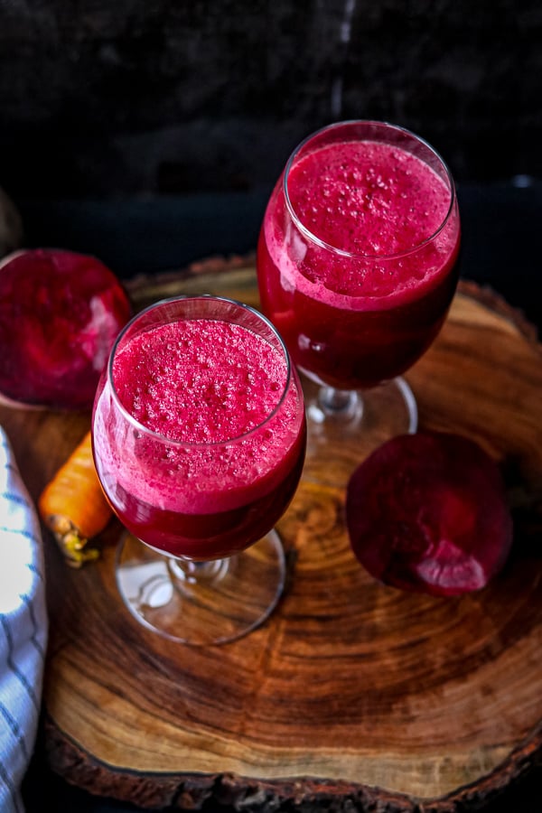 Beet Carrots Apple Juice Recipe in two glasses on wooden board