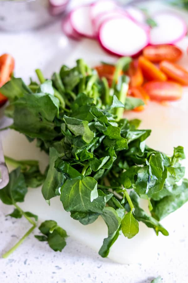 The benefits of Fresh watercress with chopped vegetables 