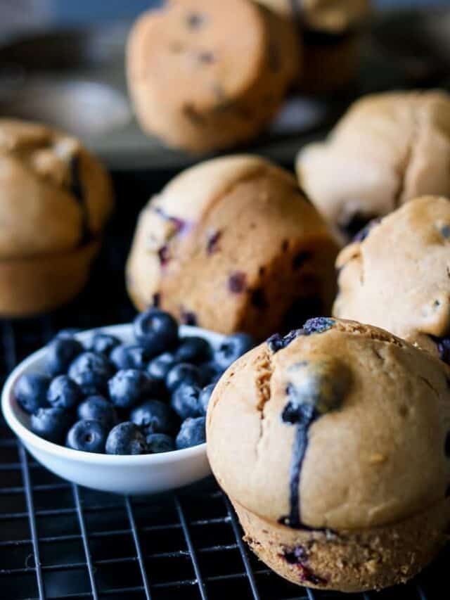Whole Wheat Baked Blueberry Muffins on cooling rack