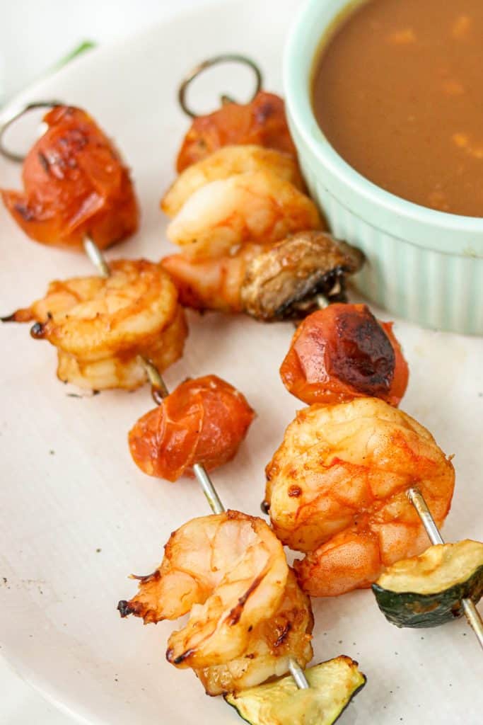 prawn sticks on a plate with peanut sauce 