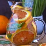 Orange Infused Water In pitcher With oranges slices