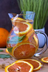 Orange Infused Water In pitcher With oranges slices