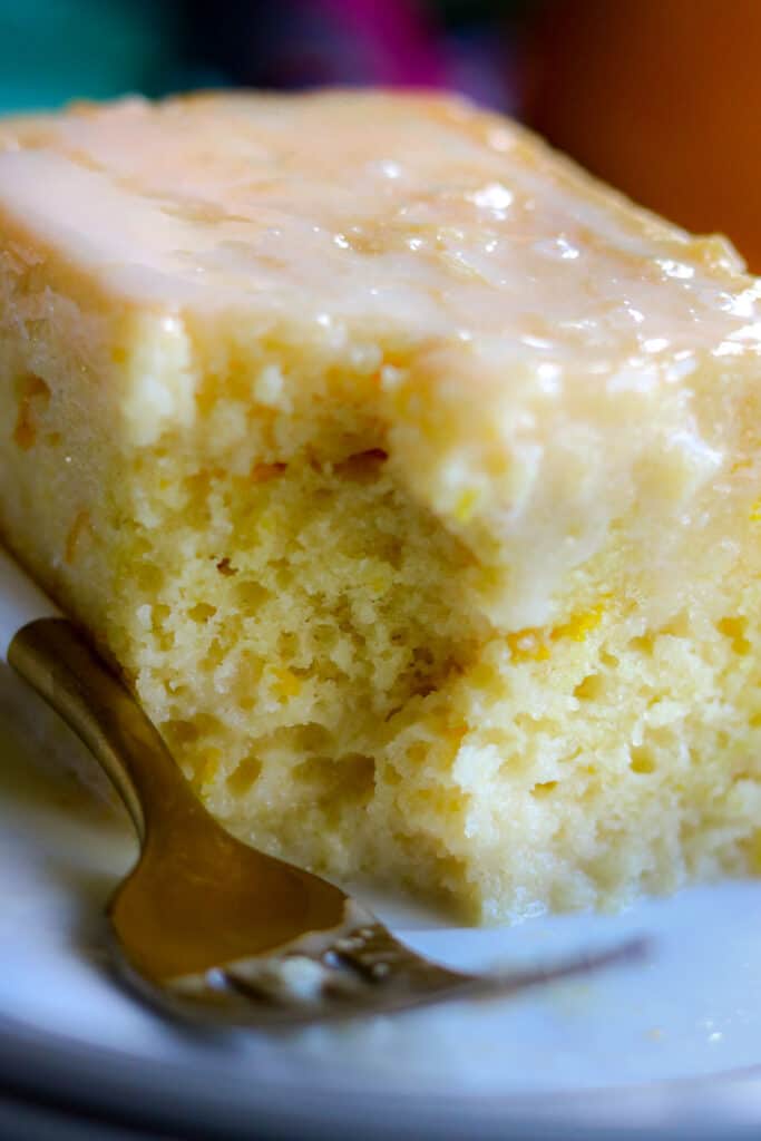 orange cake with bite and fork