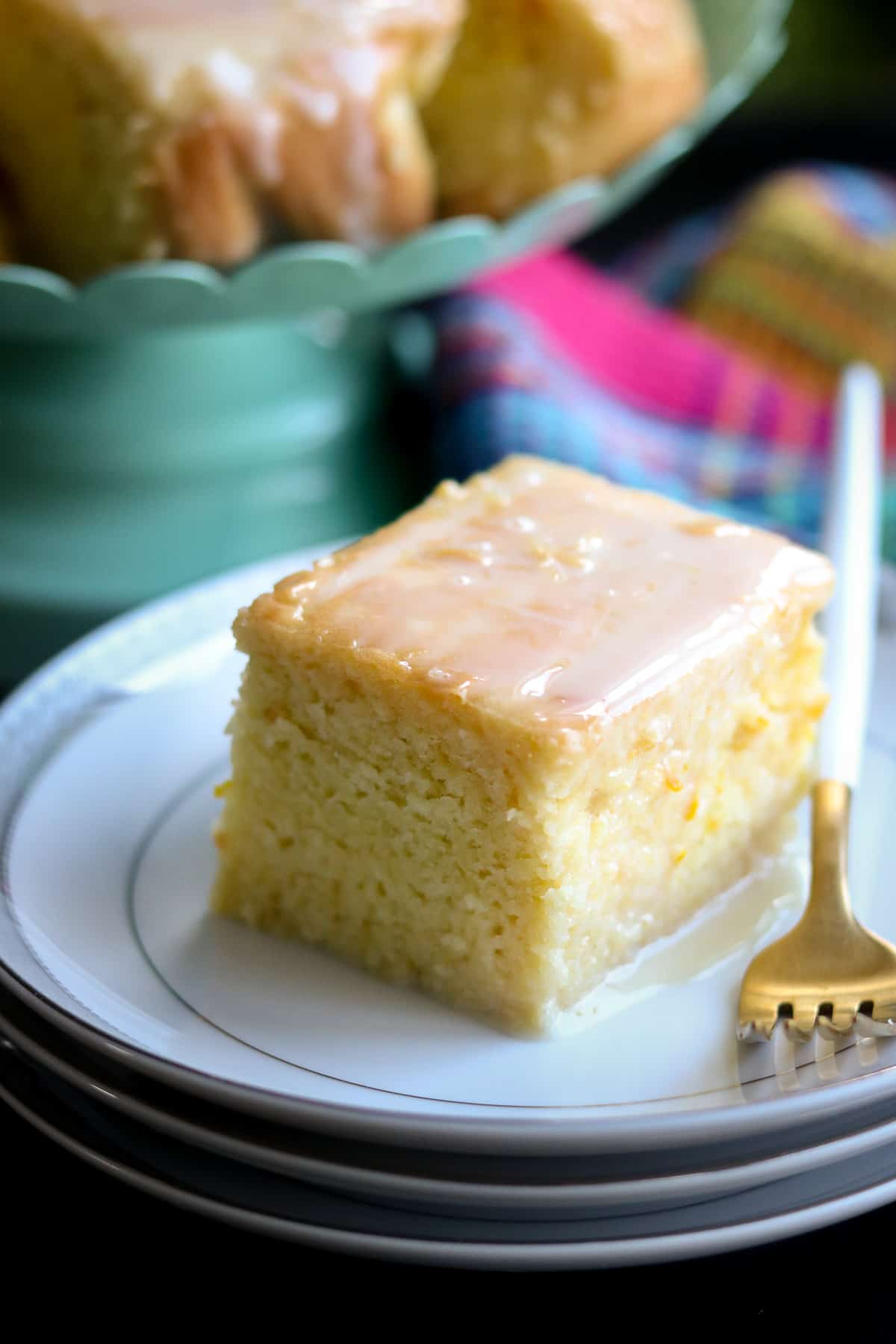 Air Fryer Orange Cake On white plate with gold and white fork