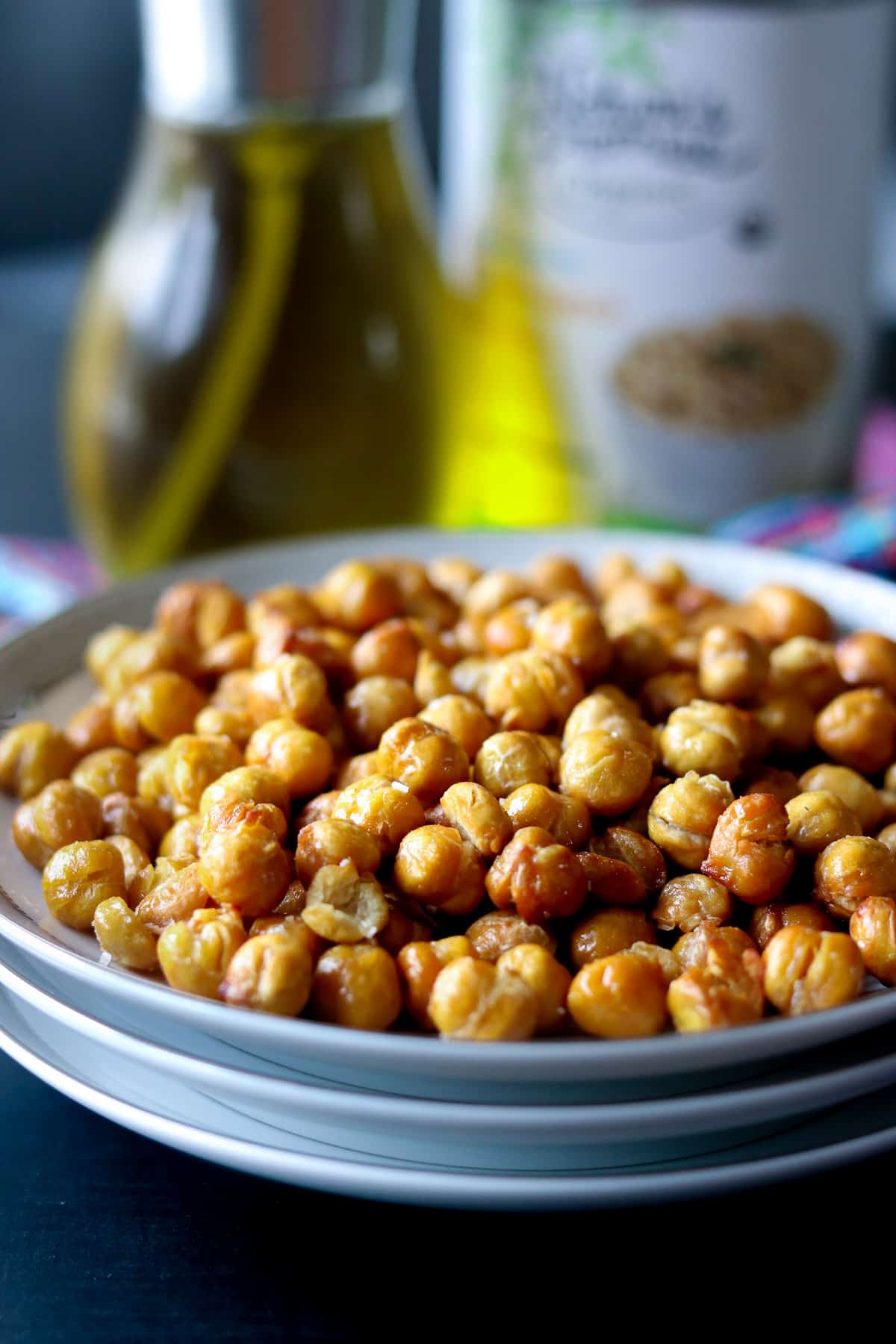 Roasted chickpeas on a stack of white plate