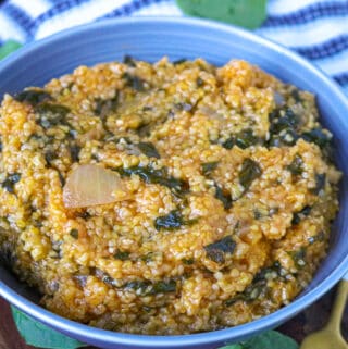 Cornmeal with spinach in blue plate
