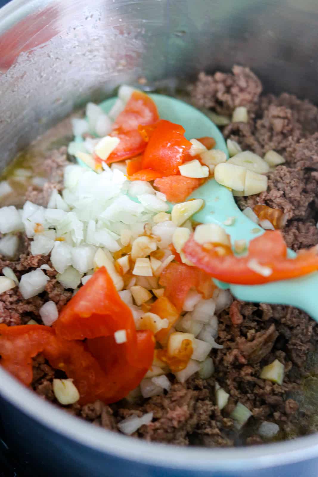 Meat and ingredients in pot