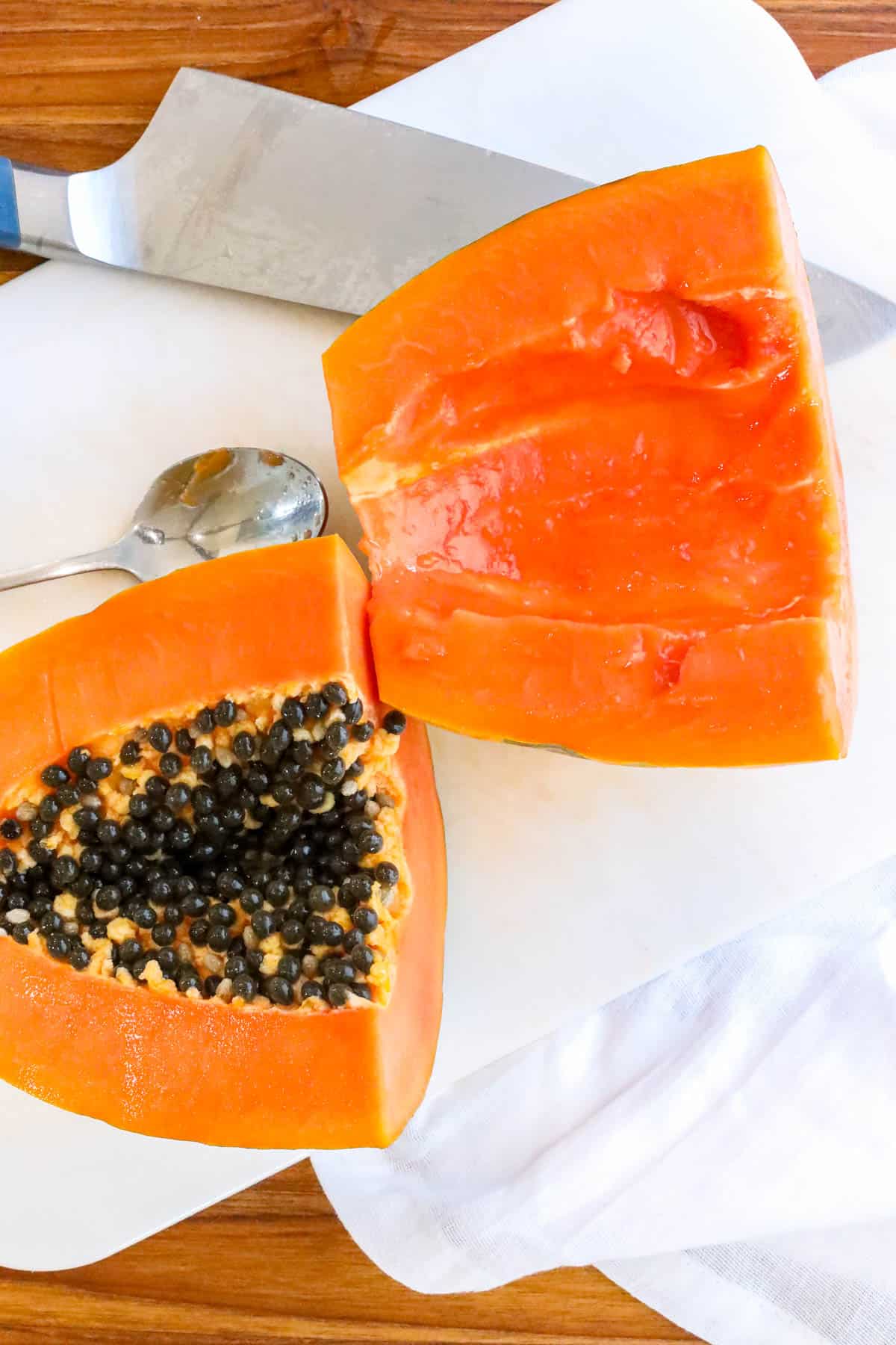 papaya with seeds sliced in half