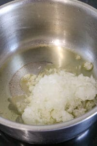 onions and garlic sauté in oil in saucepan
