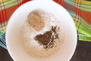 Flour, sugar, spices in a white bowl.