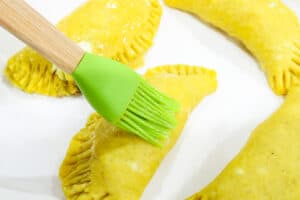 dough being brushed with eggwash