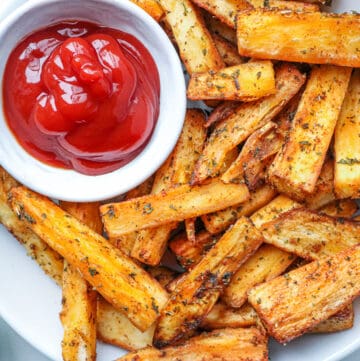 fries in the white plate with ketchup