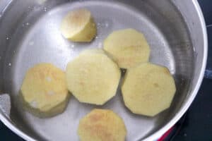 boiled tuber vegetable in hot water in pot
