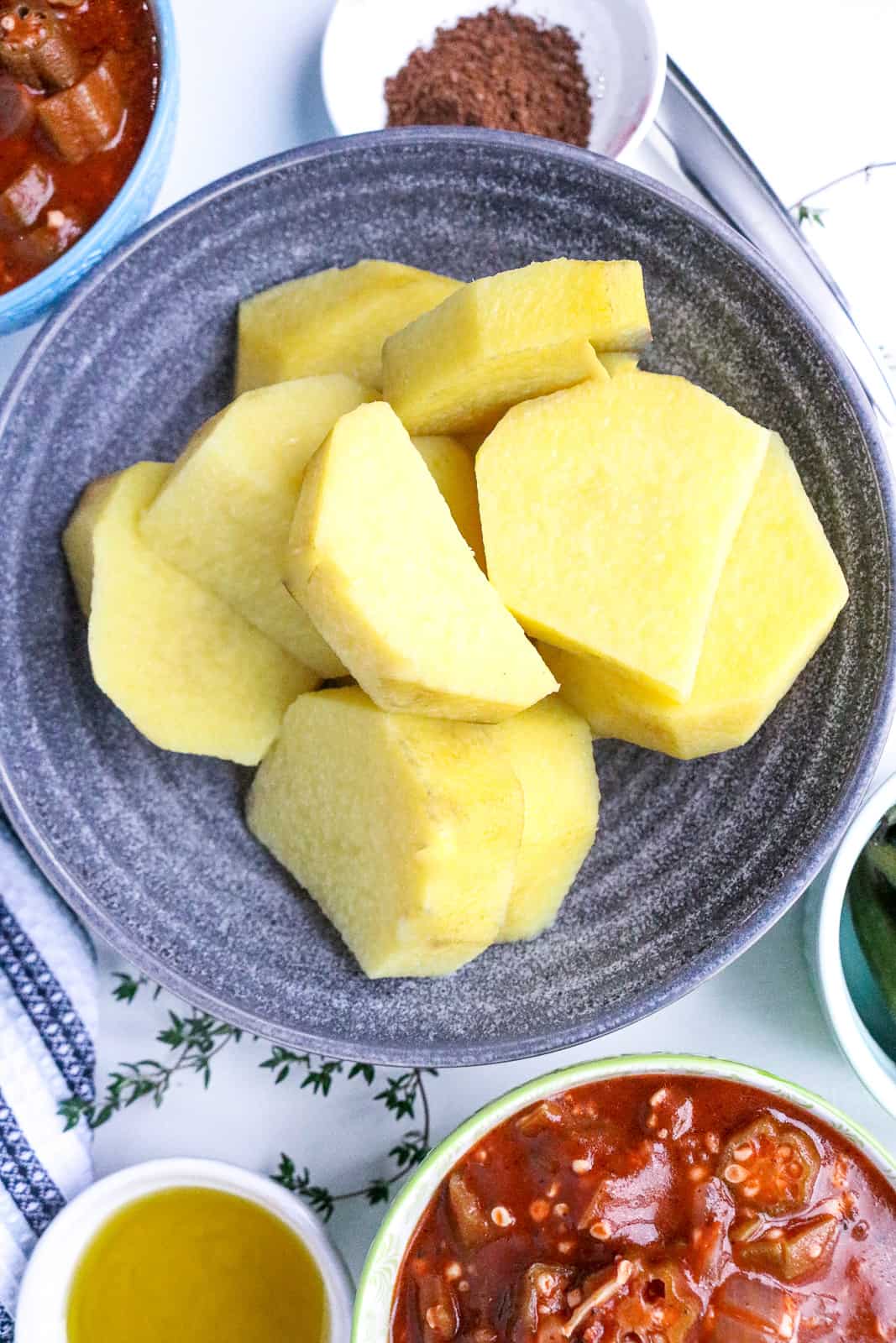 Cooked yellow yams in gray bowl
