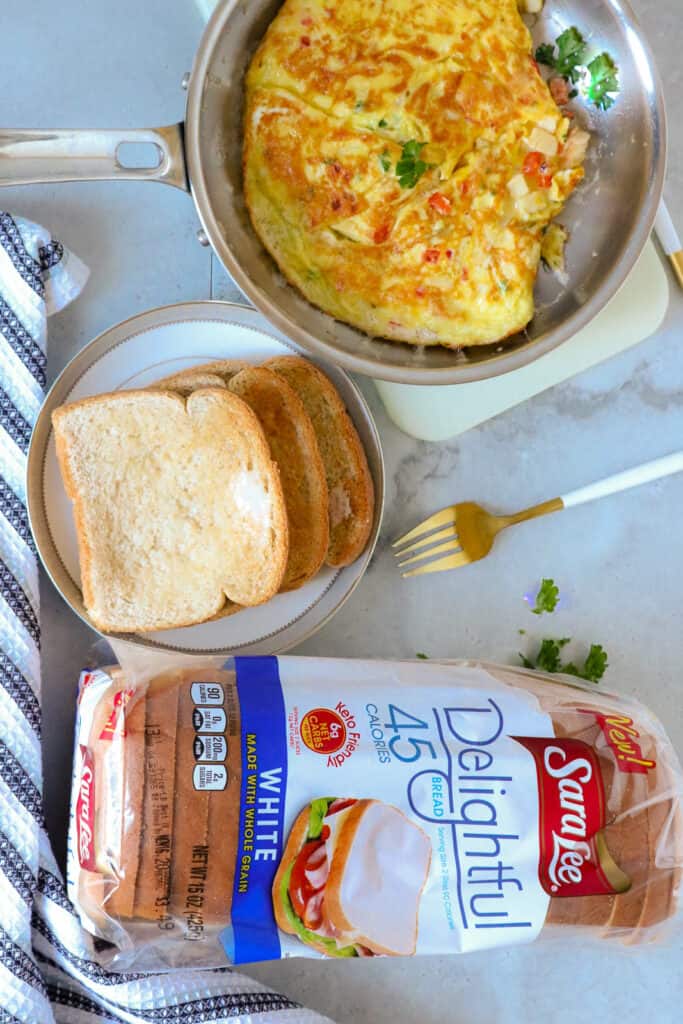 Haitian Eggs in pan with bread