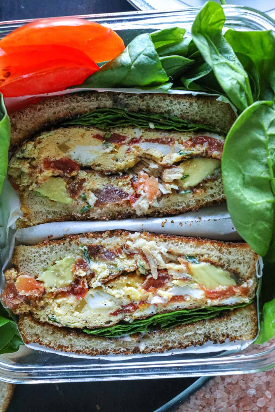 Egg sandwich with spinach and tomatoes