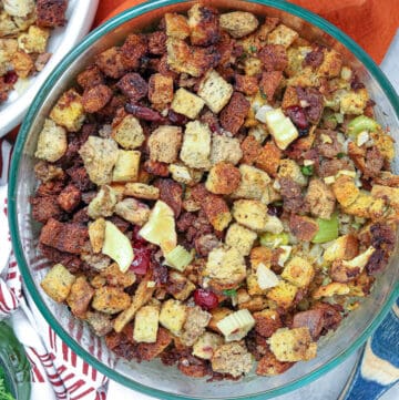 stuffing in baking dish with wooden spoon showing