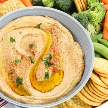 dip in gray bowl with fresh veggies and crackers