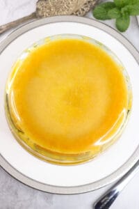 glass bowl flipped upside down on white plate