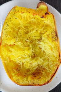 cooked spaghetti squash on white plate