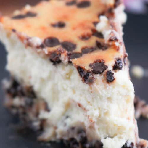 Cheesecake slice on black plate