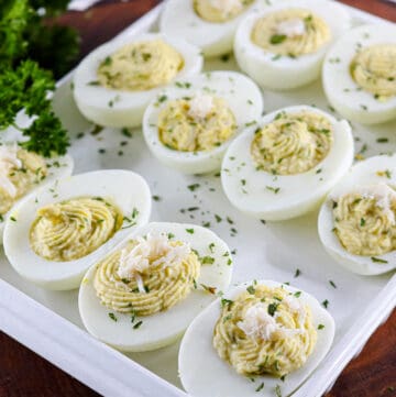 deviled eggs on wooden board